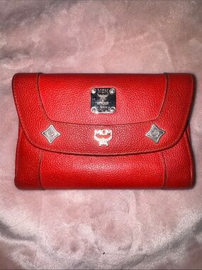 MCM Red Pebbled Leather Fold-Over Wallet.